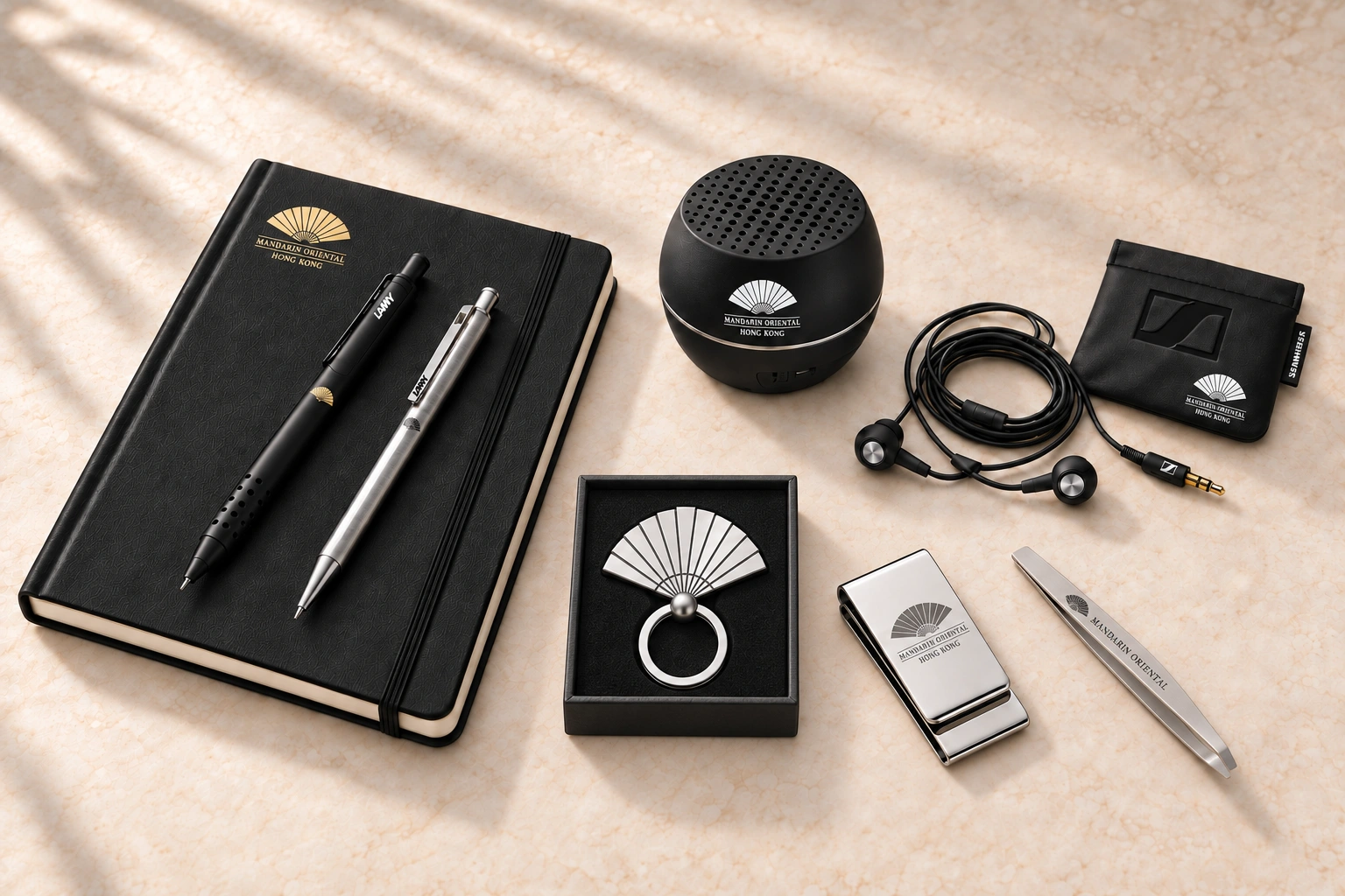 Mandarin Oriental branded notebook, pens, speaker, earphones and gift accessories