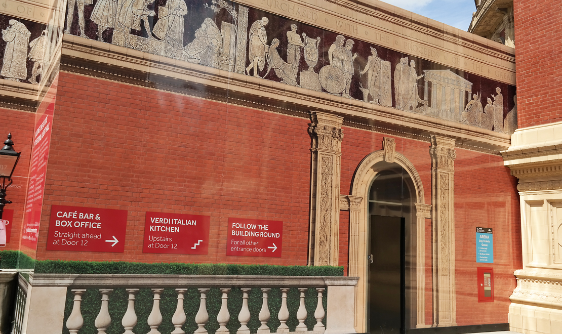 Royal Albert Hall architectural hoarding installation seen from the surrounding public plaza.