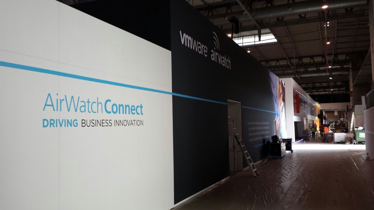 AirWatch exhibition interior with Business Mobility graphics, demonstration stations and meeting furniture