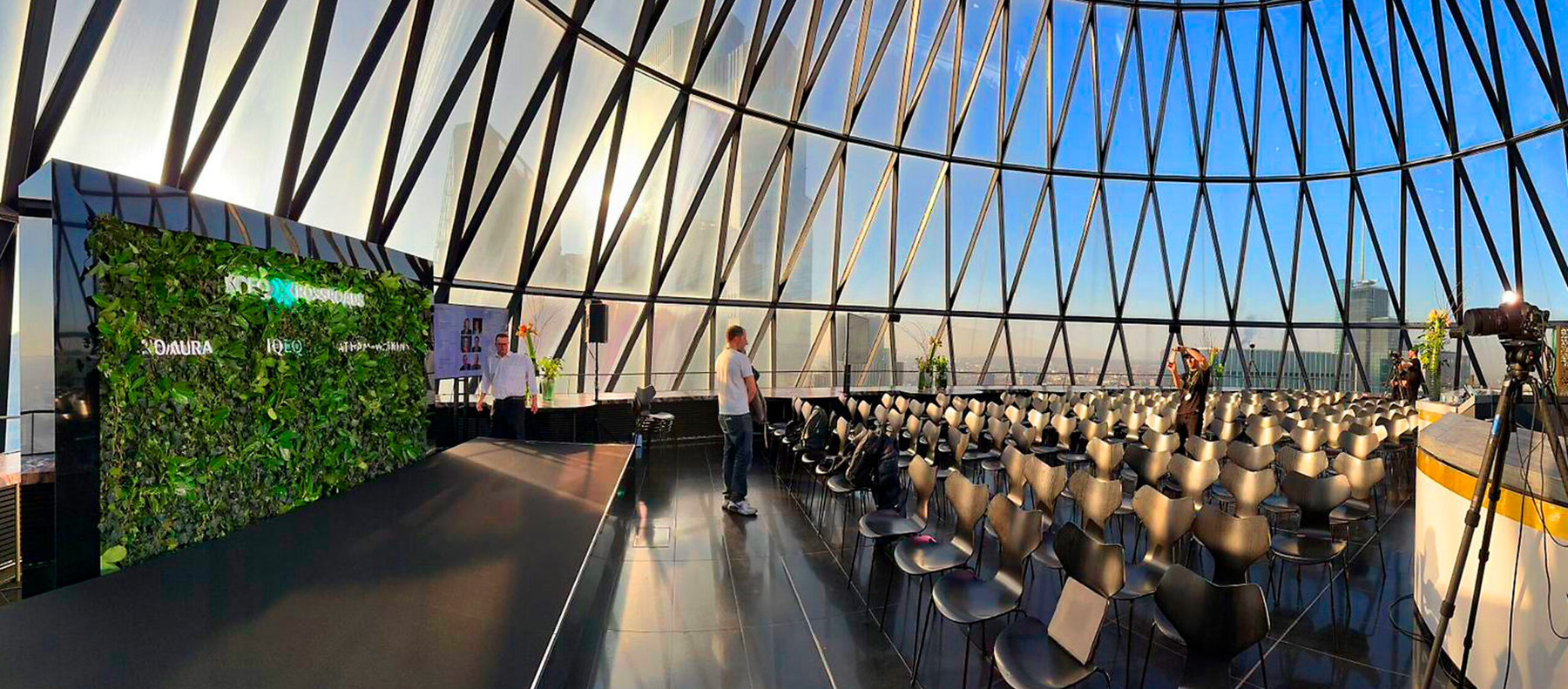 Awards event backdrop in a glass-roofed venue