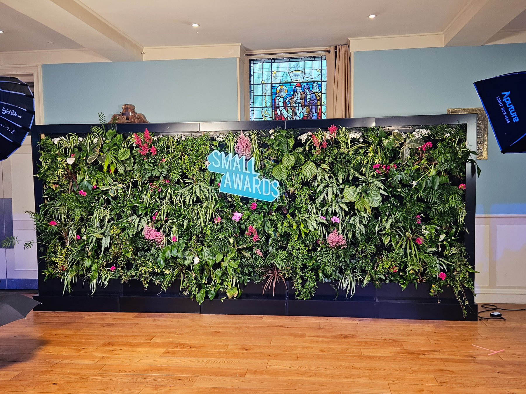 Small Awards branded living wall with colourful planting