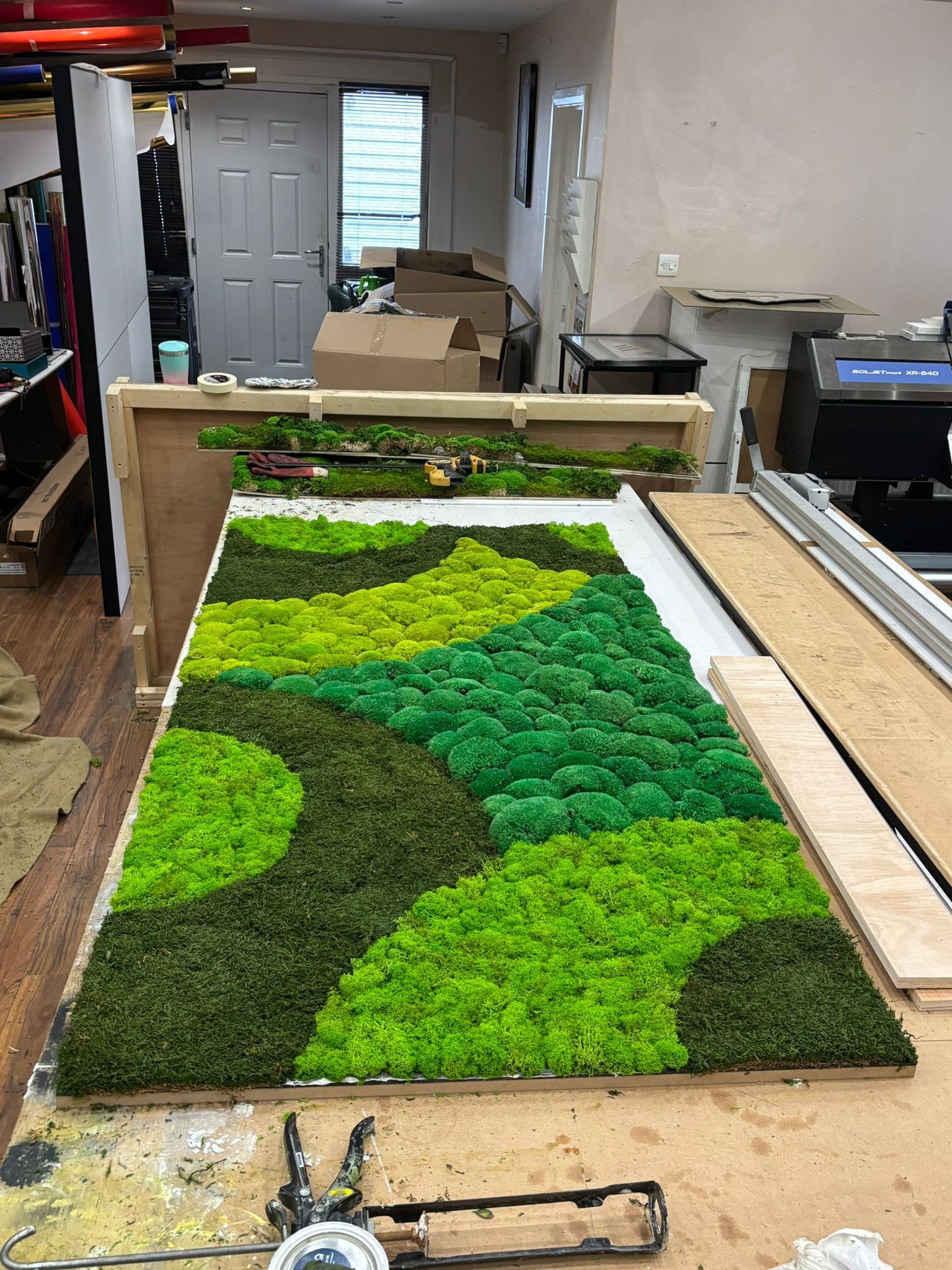 Moss wall fabrication in workshop
