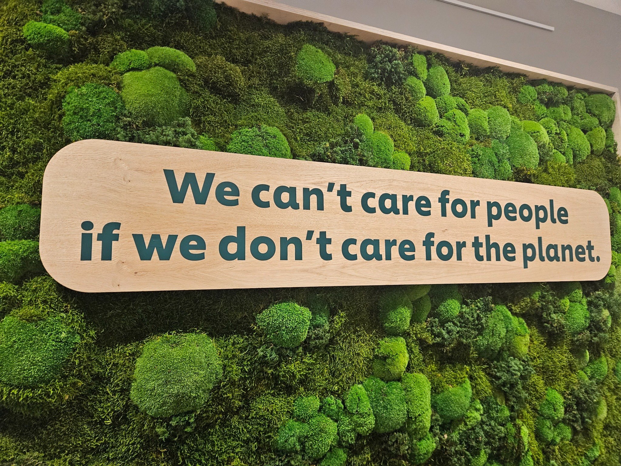 Moss wall with sustainability message
