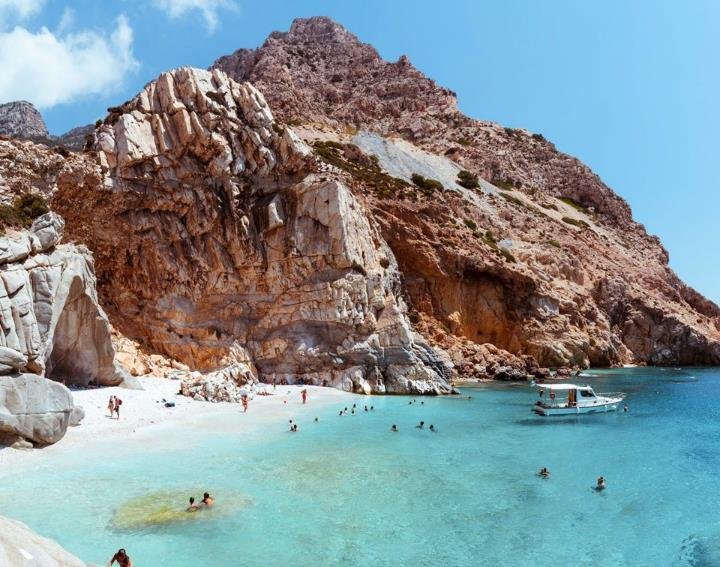 A ship anchored off a hidden Aegean beach