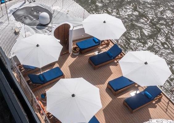 Sun deck with parasols on M/Y Harmony G