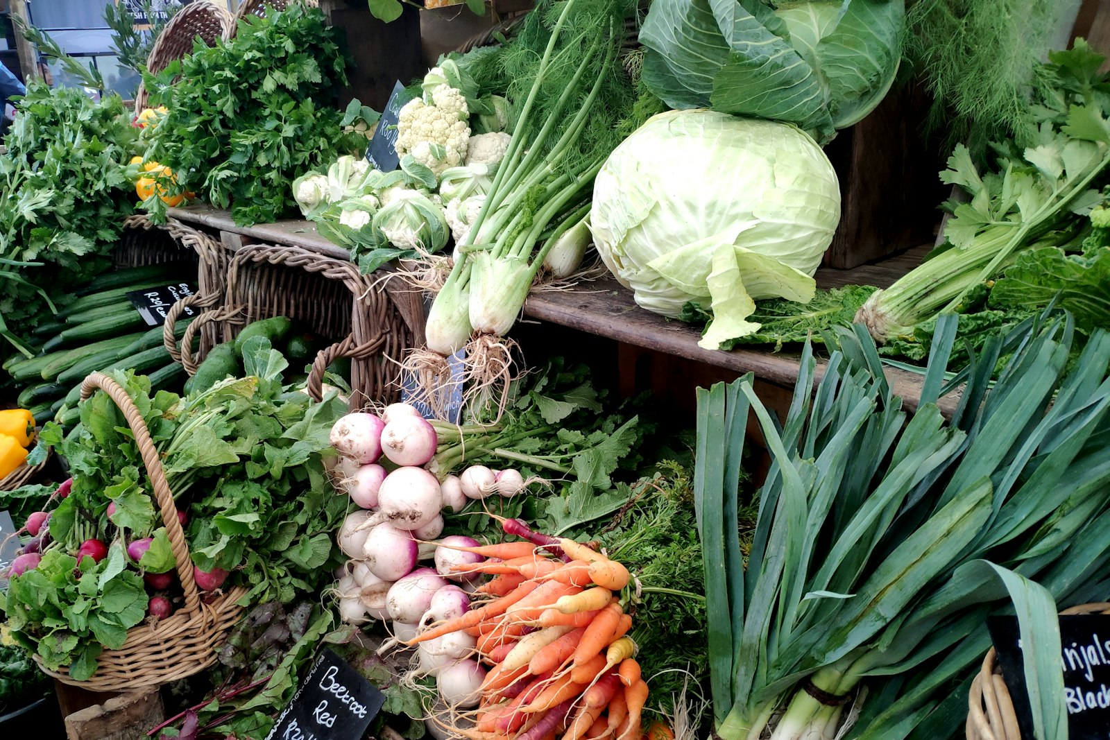 Organic vegetables piled at a market