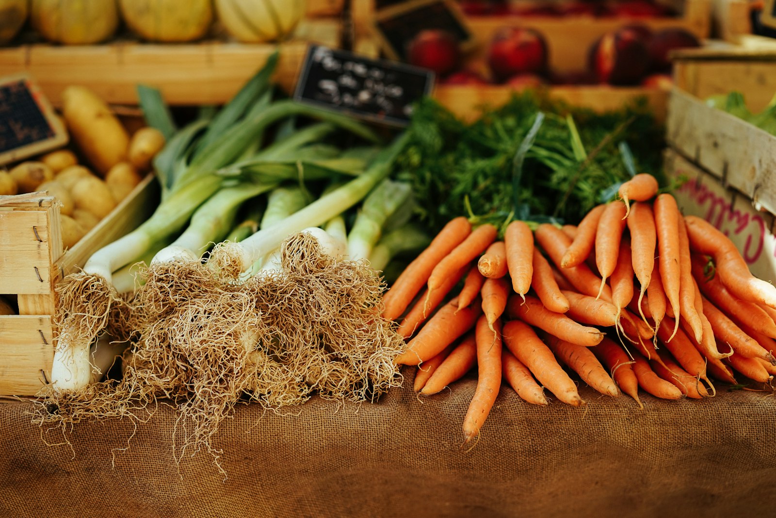Carrots and leeks at a market stall