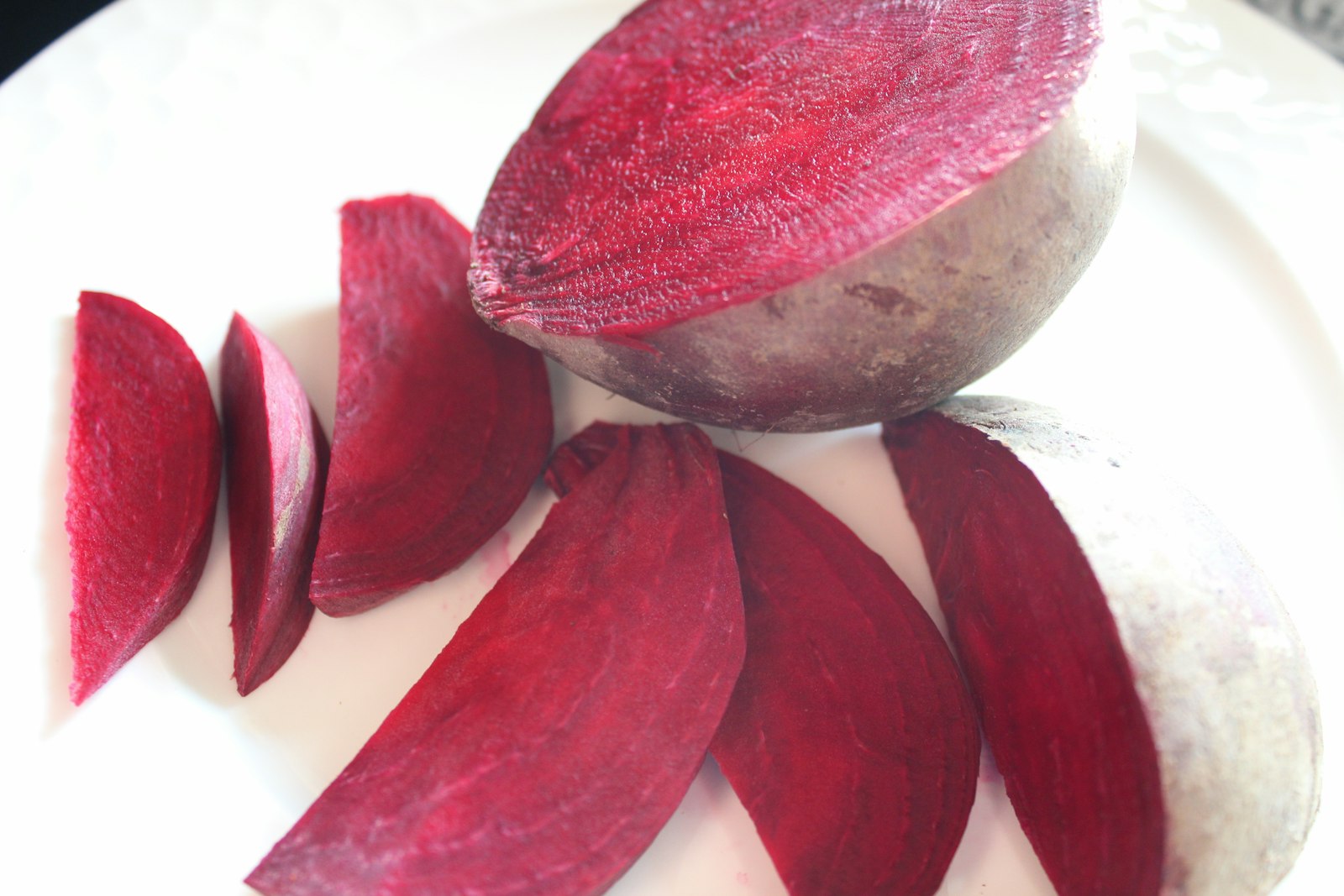 Thinly sliced fresh beets on a plate