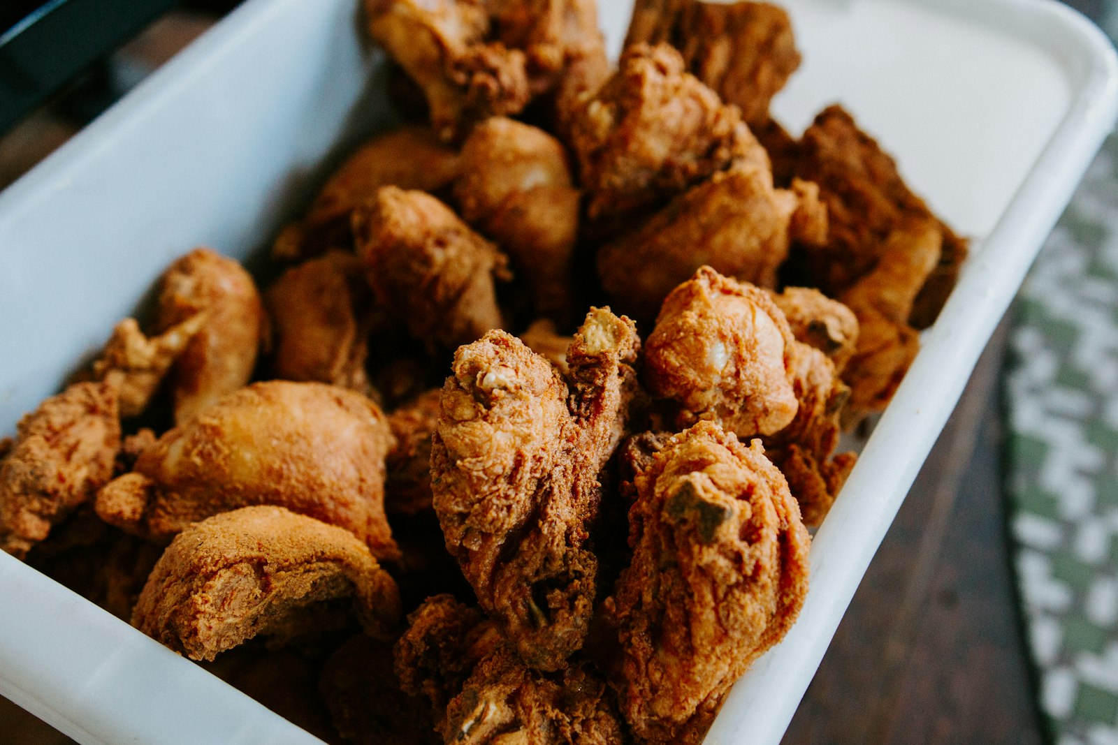 Golden oven-fried chicken in a baking dish