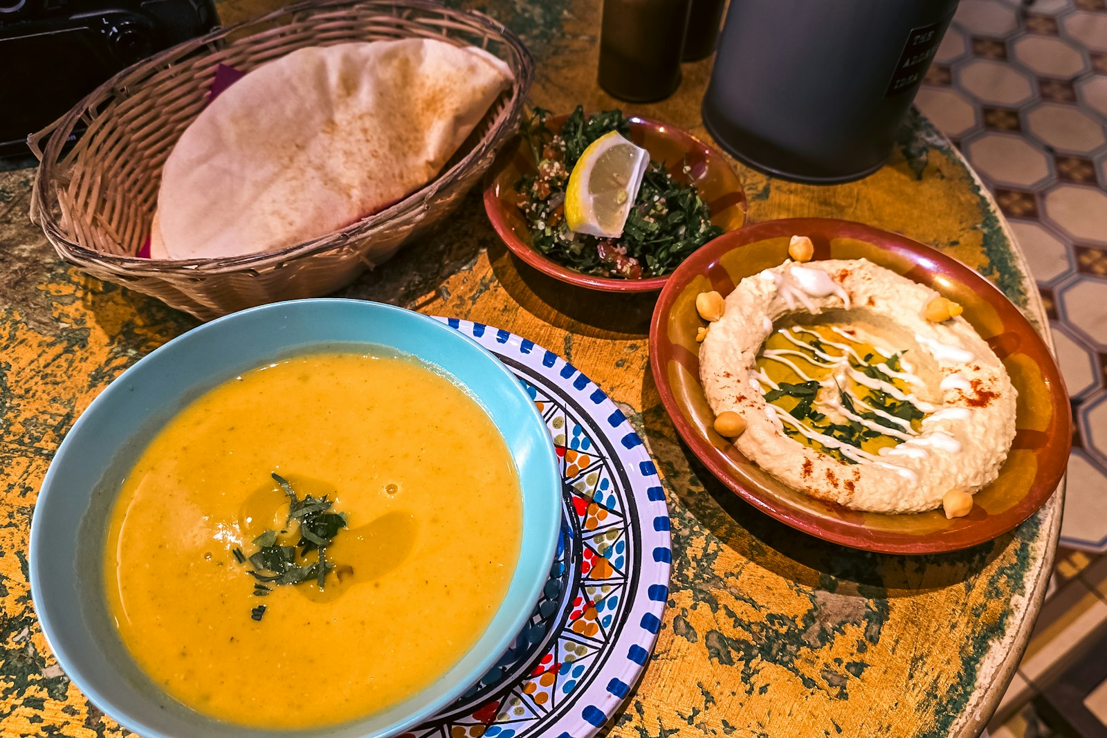Squash dip with pita on a rustic table