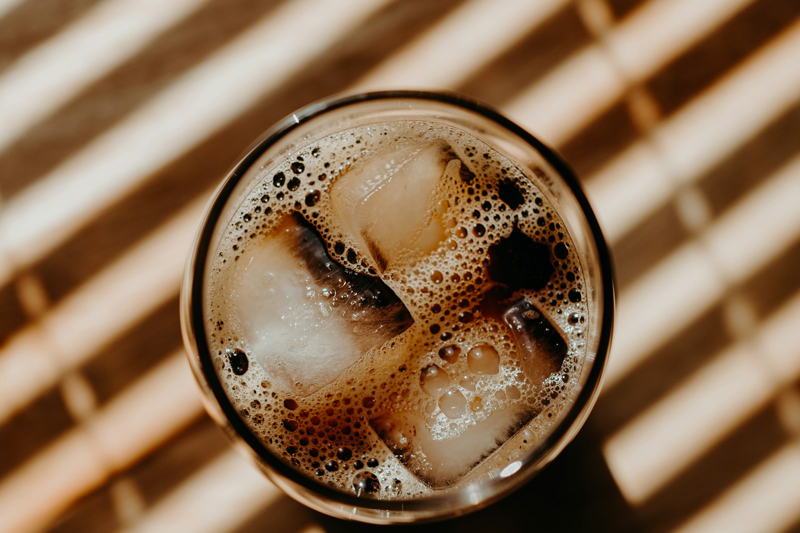 Glass of root beer over ice