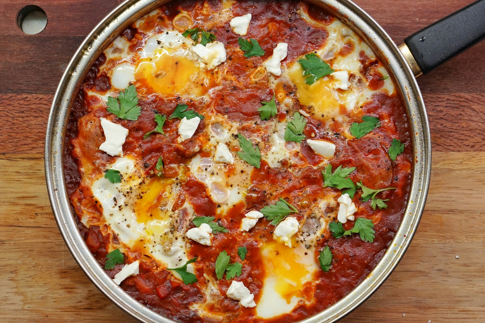 Eggs baked in tomato sauce in a skillet