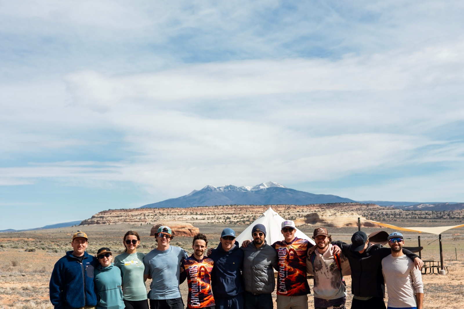 The crew lined up against the mesa