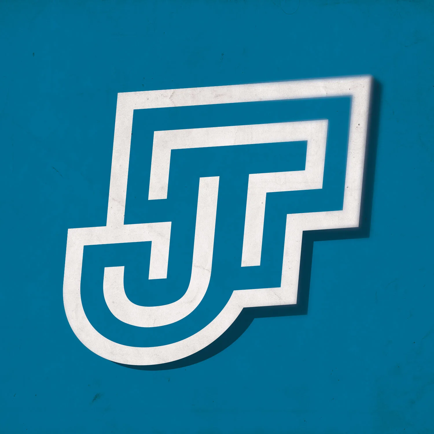 JT monogram logo: interlocking white outlined J and T letters, angled, on a textured teal background