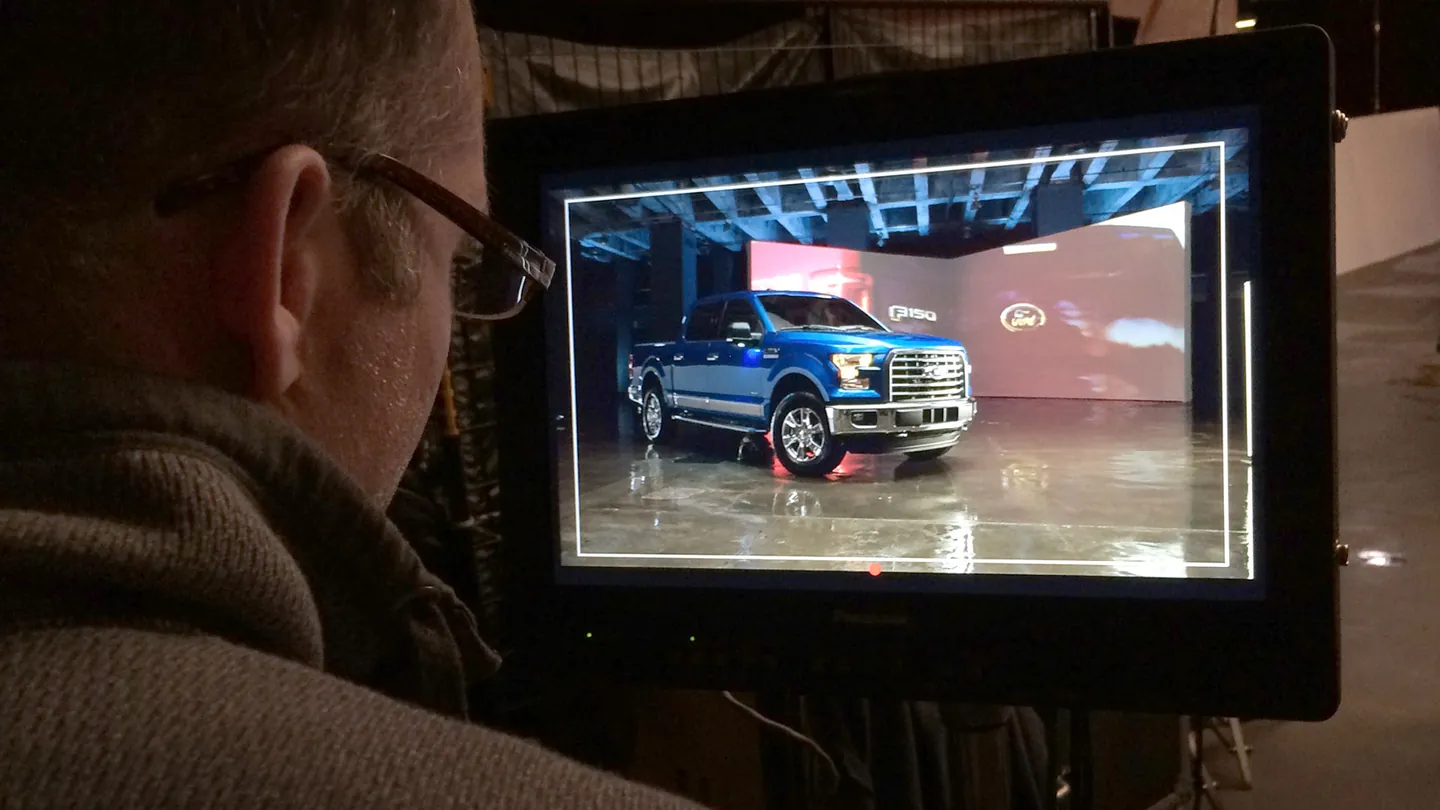 Crew member watching the Ford F-150 shot on the on-set monitor