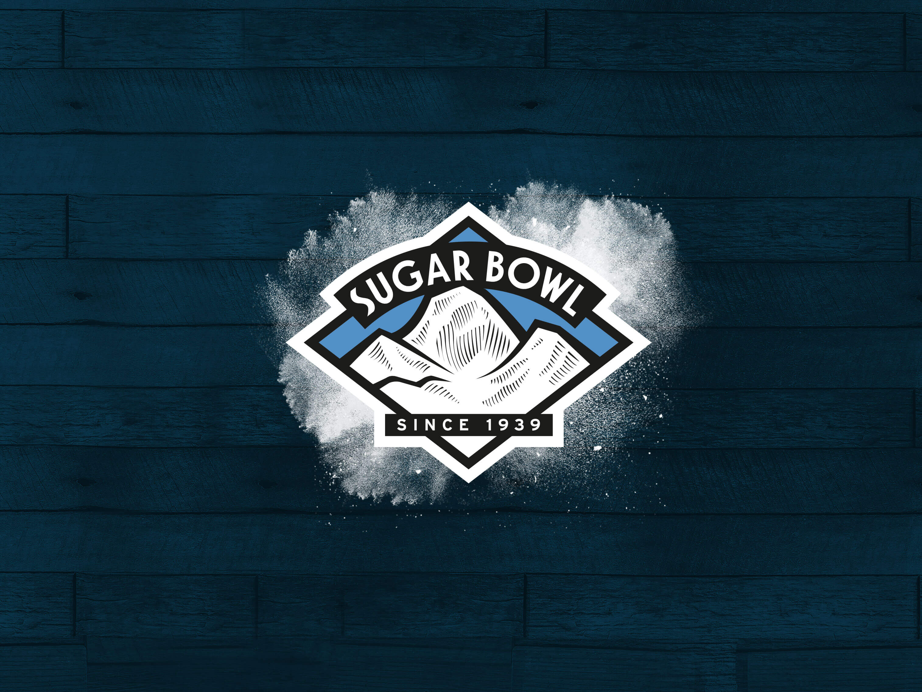 Sugar Bowl resort logo on a dark wood background, Ford activation