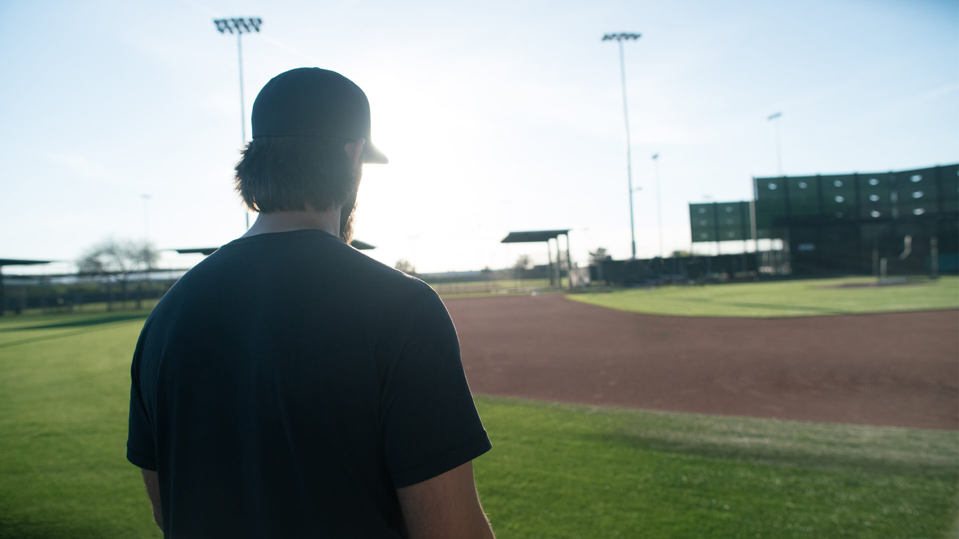 Madison Bumgarner walking onto a ball field at sunset, Ford Defy Expectations