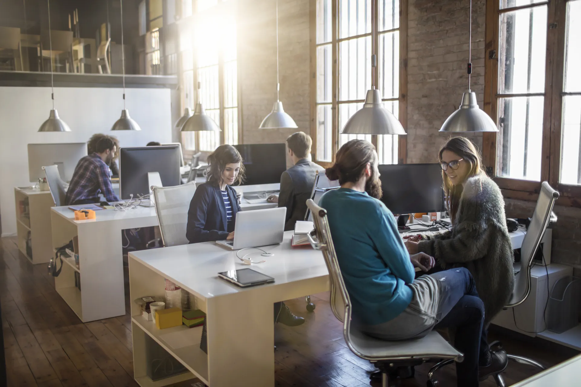 Team working in a sunlit open-plan office