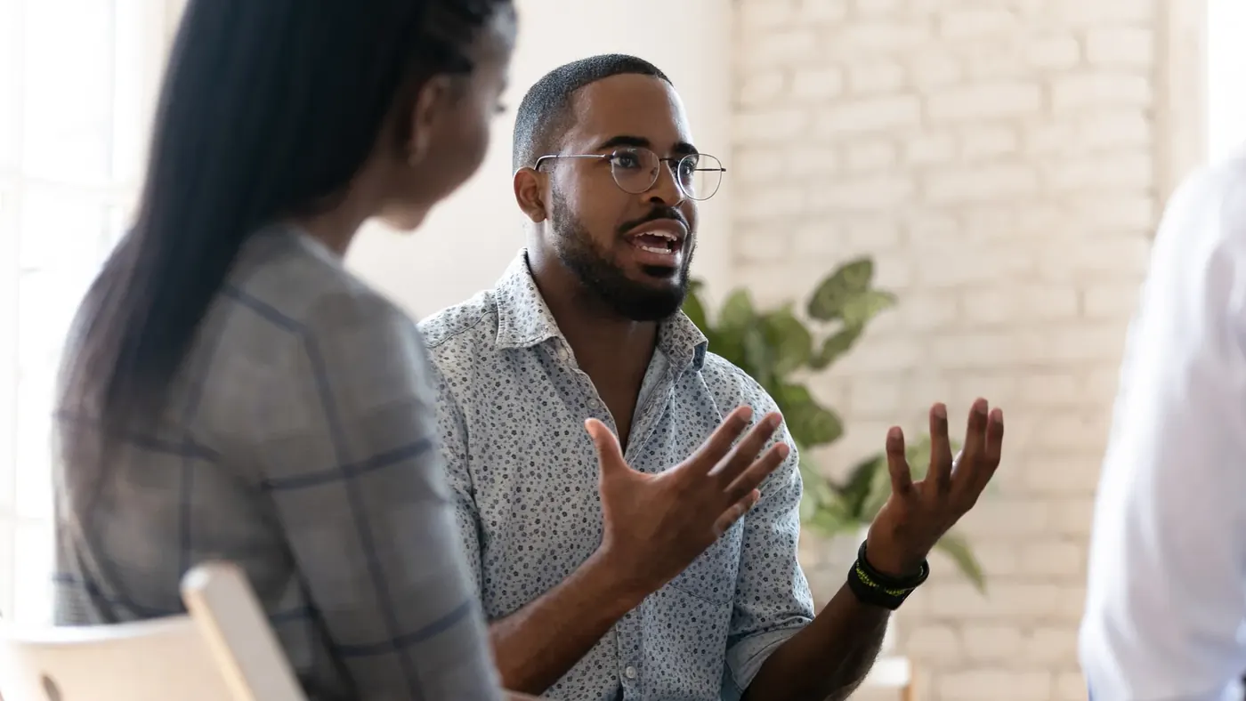 Colleagues discussing marketing standards in a meeting