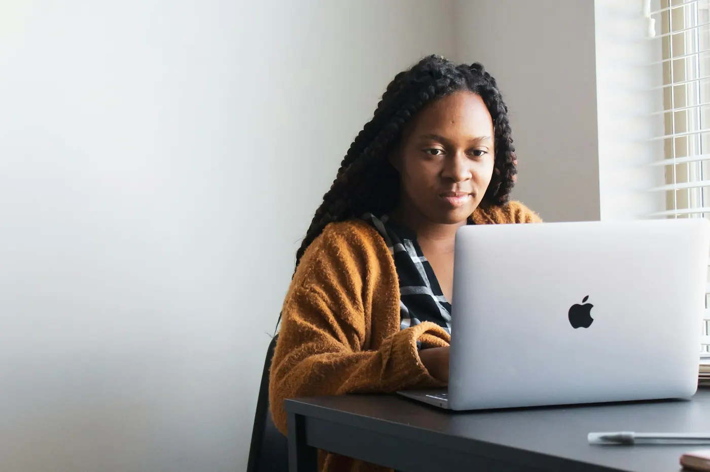 Marketer reviewing a campaign page on her laptop