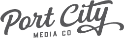 Port City Media Co wordmark logo in a stylized script font.