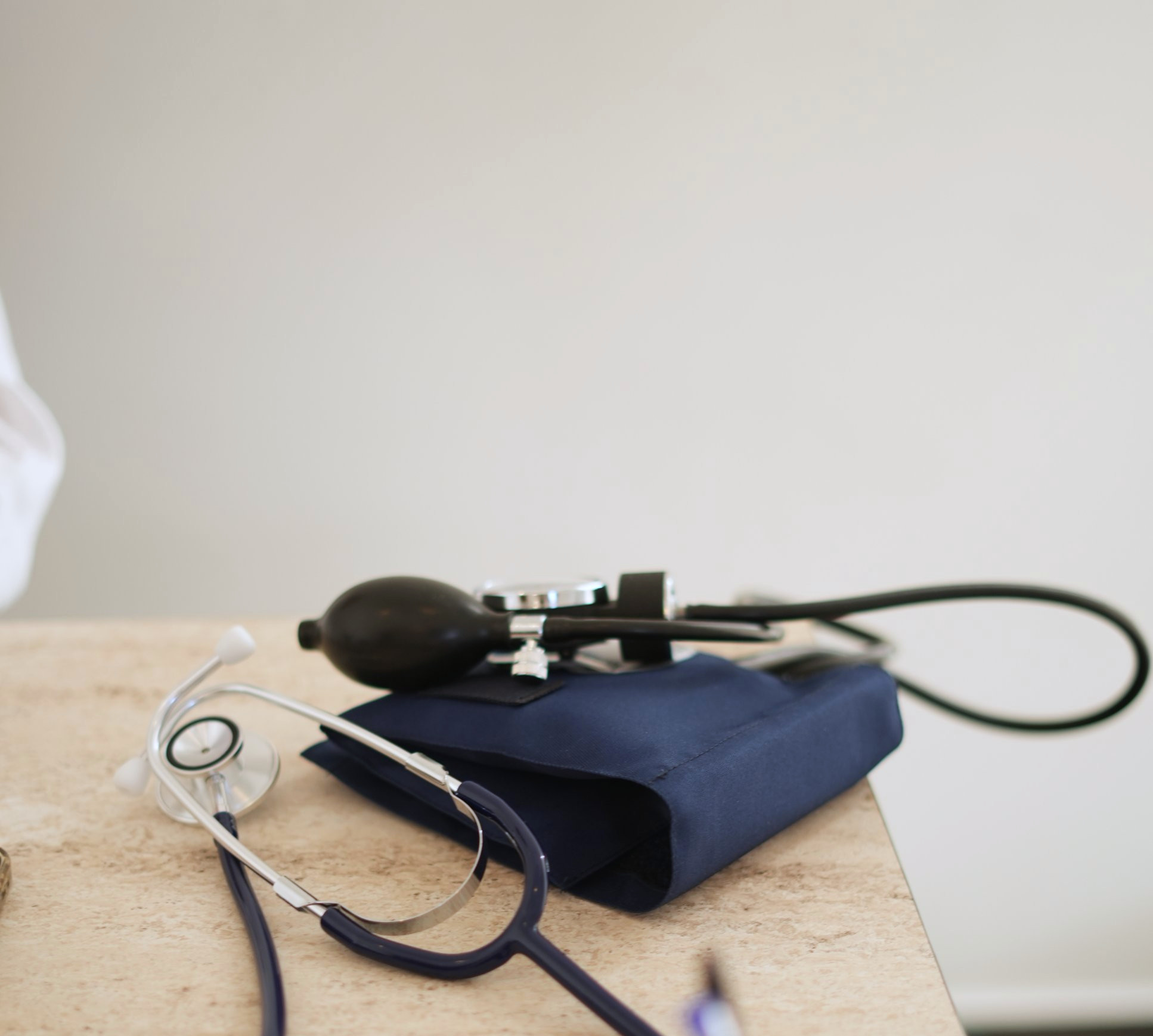 Stethoscope and blood pressure cuff on the clinic desk