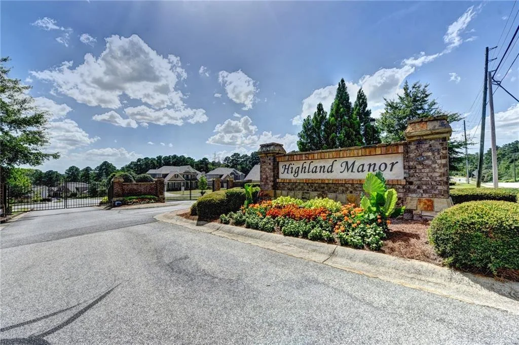 Stone subdivision entrance with landscaping