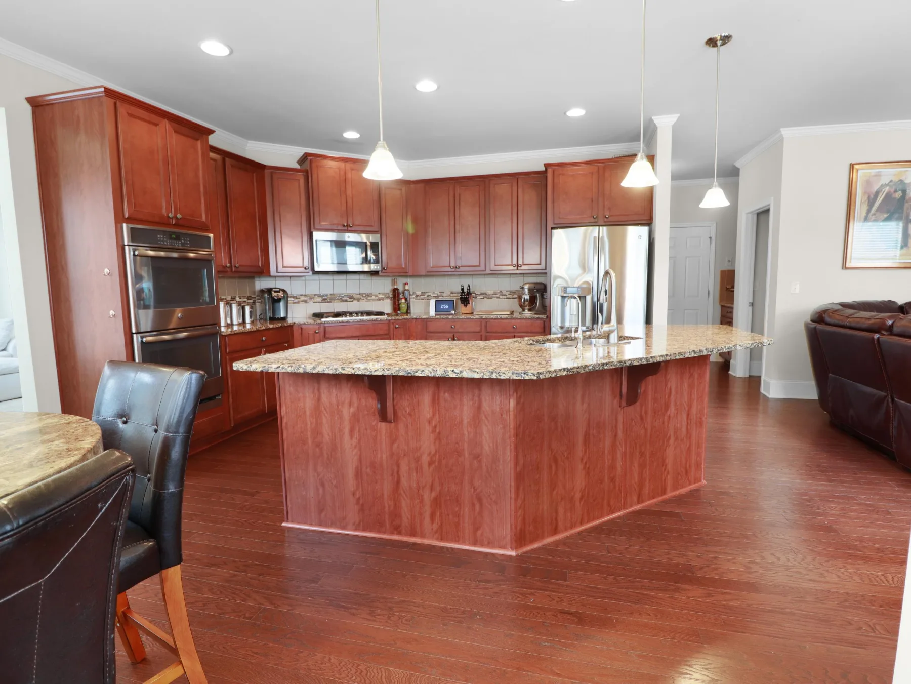 Kitchen with cherry cabinets and island