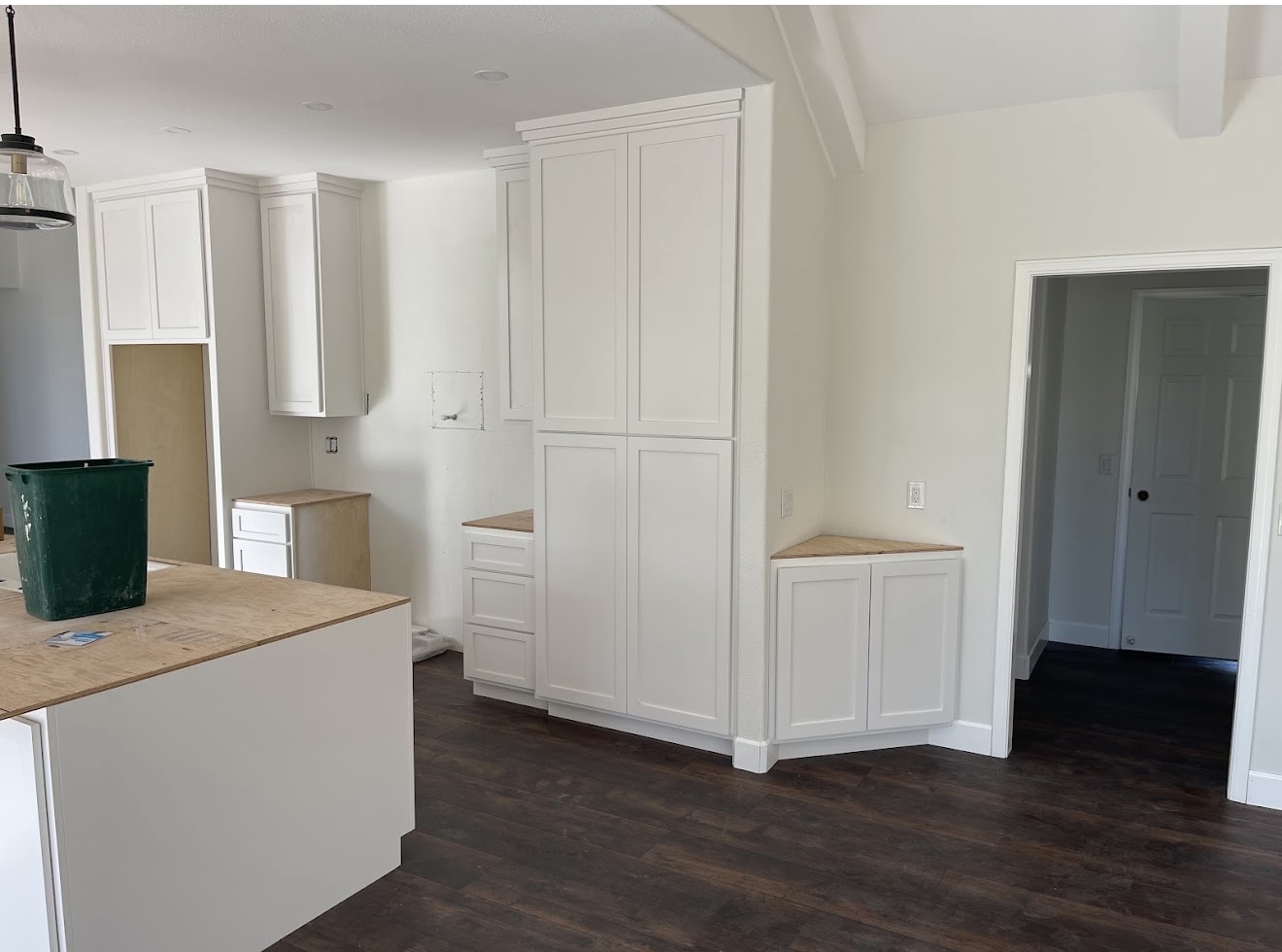 Bright interior painting and white cabinet finish project by Coastline Painting