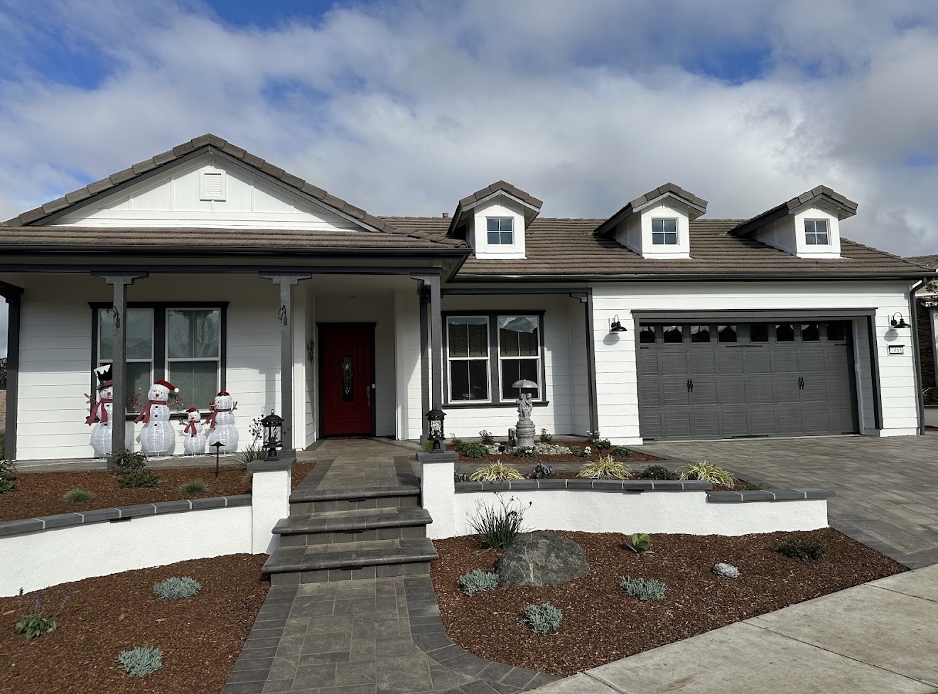 Finished white home with charcoal trim after exterior painting by Coastline Painting