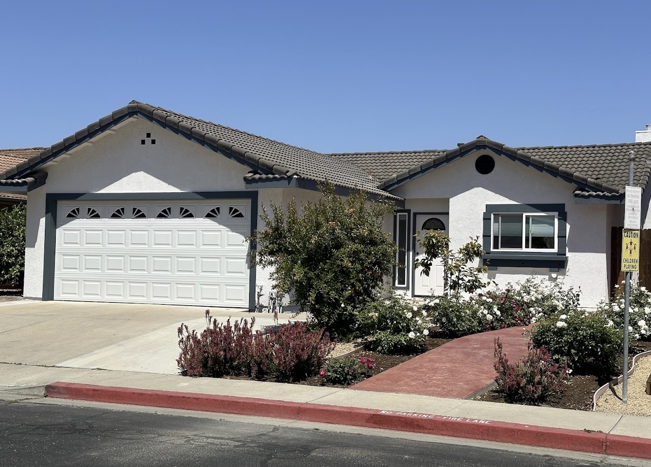 Finished white and gray exterior house painting project by Coastline Painting in the Santa Maria area