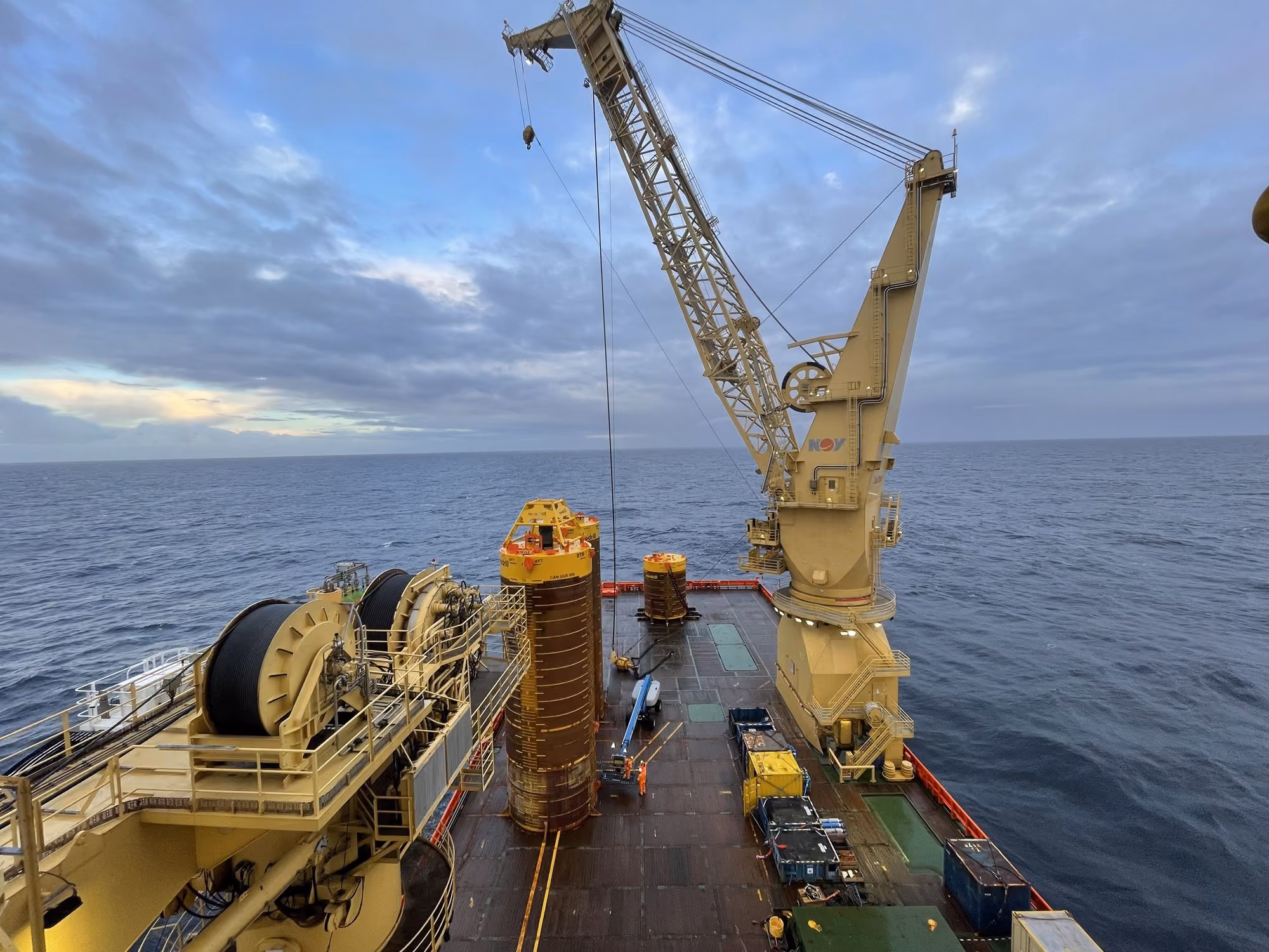 Offshore crane and subsea equipment on a vessel's working deck