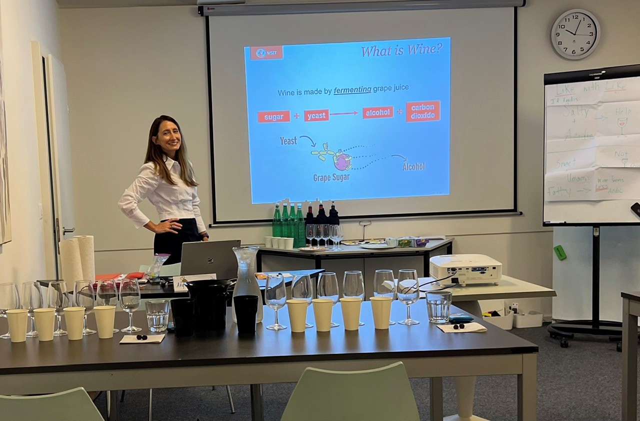 Angela Cochran teaching a wine class in Zurich