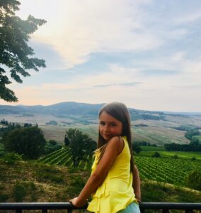 One of Sean and Angela Cochran's daughters overlooking vineyards in Tuscany