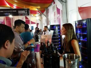 Angela Cochran hosting a wine tasting event in Asia