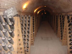 Bottles stored in an underground Champagne cellar