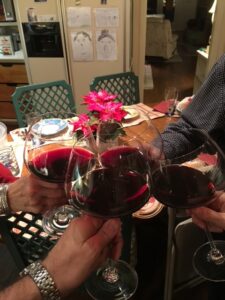 Family glasses of red wine raised together in Dublin, Ohio