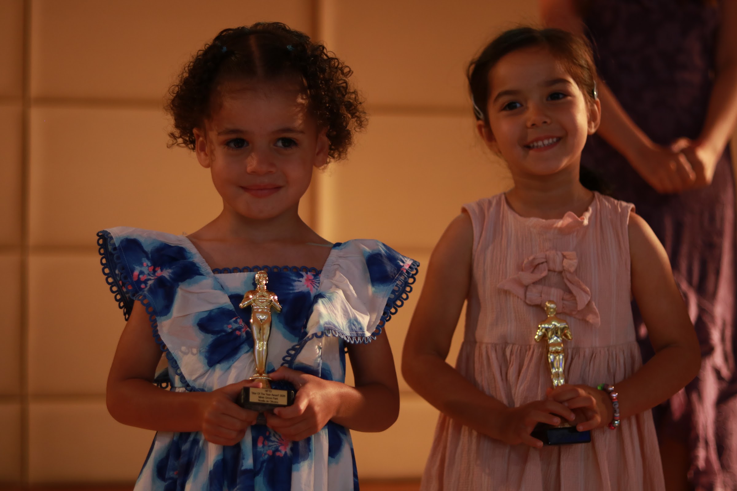 Two HFTD Minis beaming with their mini Oscars at the HFTD Oscars