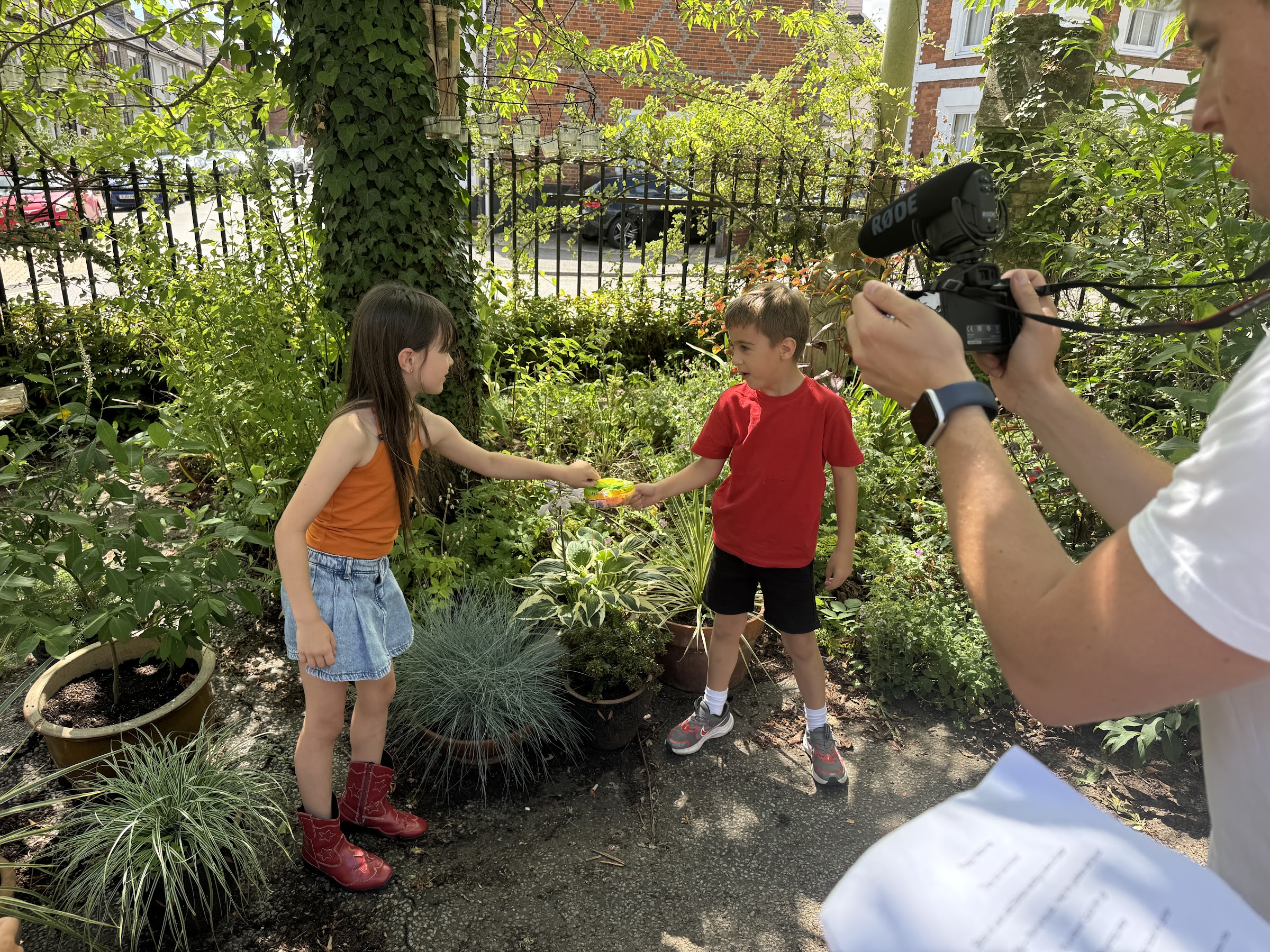 HFTD Minis filming a scene outdoors with a camera operator