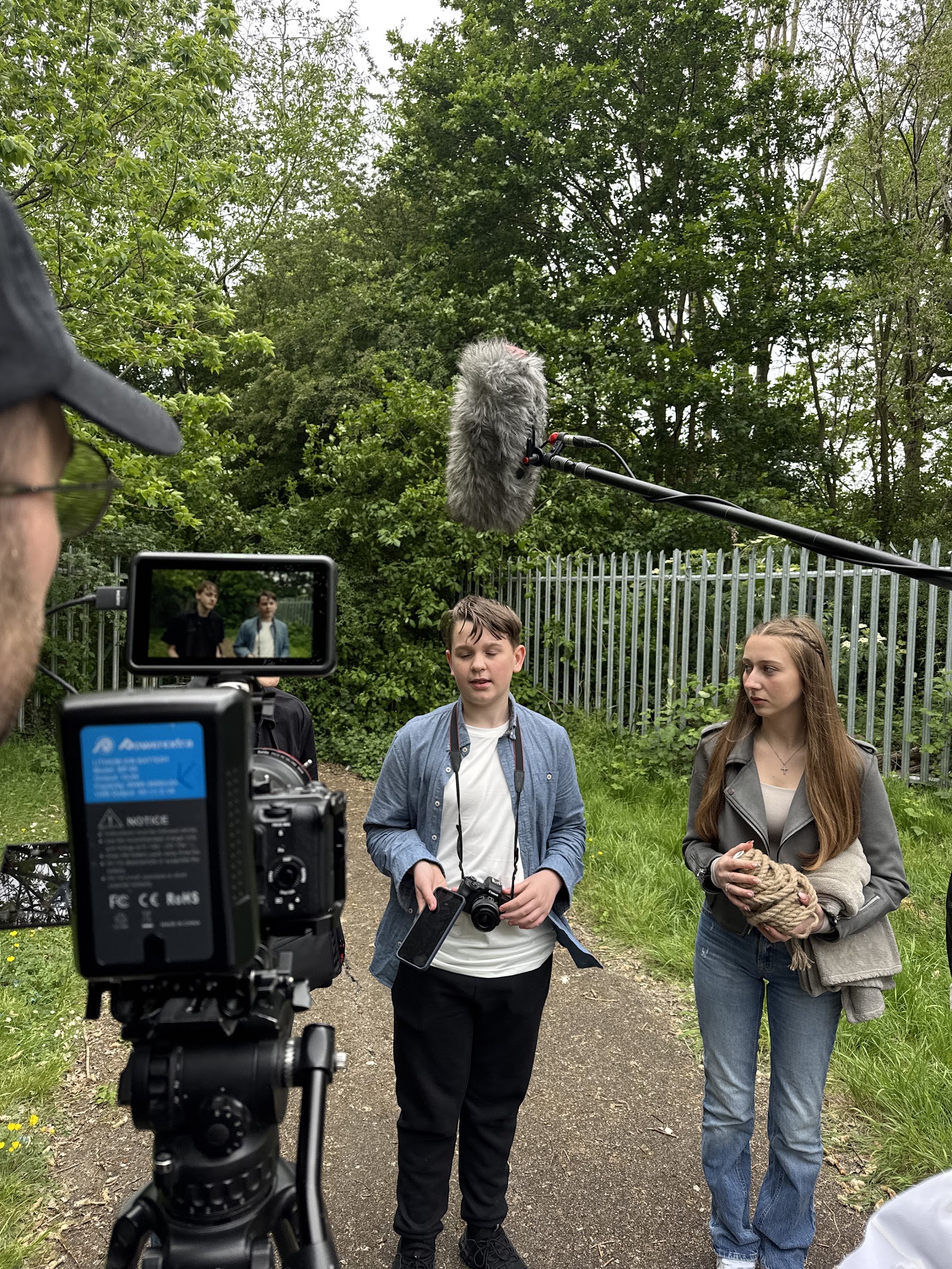 Two HFTD students filming a scene with a boom mic and camera crew