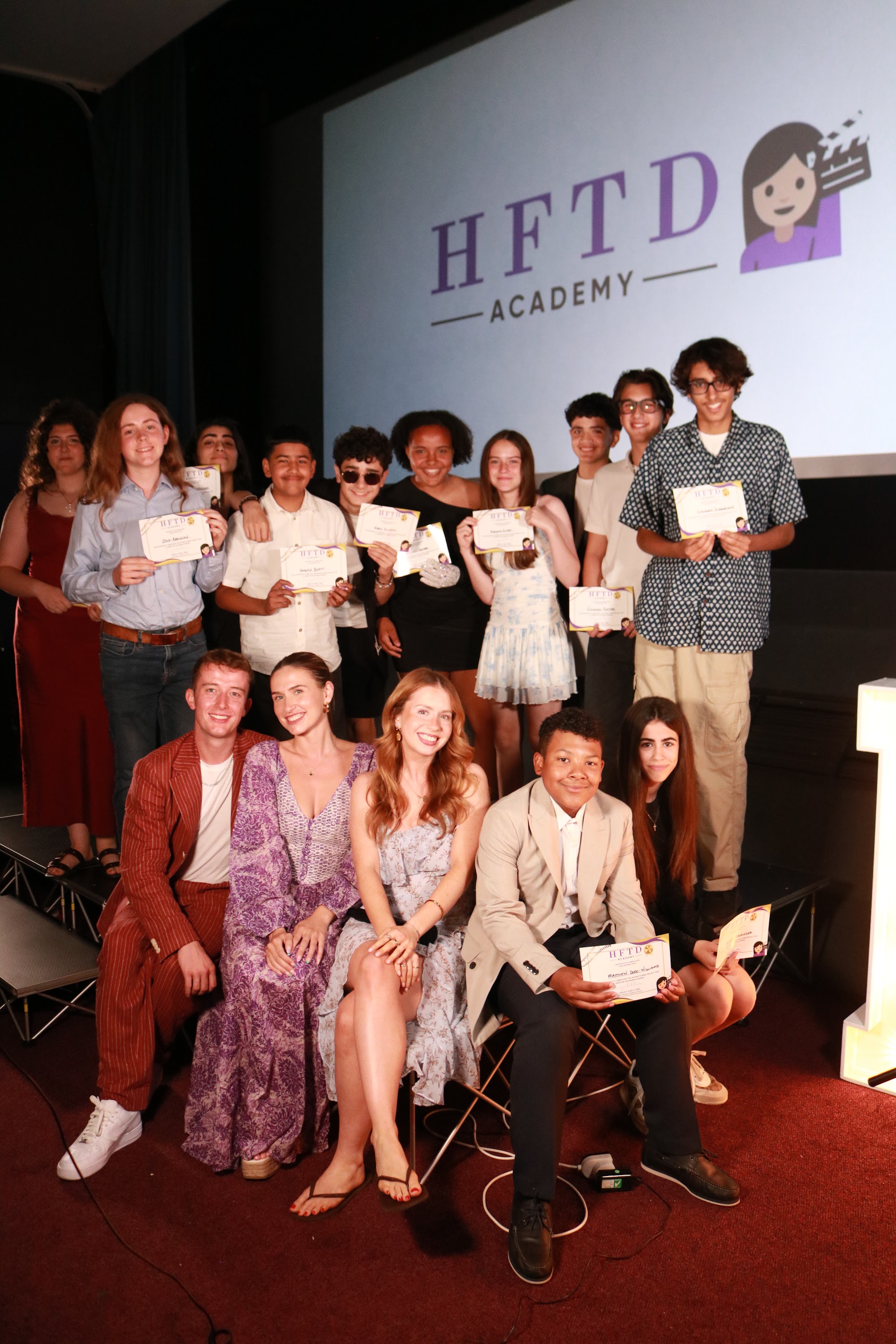 HFTD Pros on stage under the HFTD Academy banner at the Oscars
