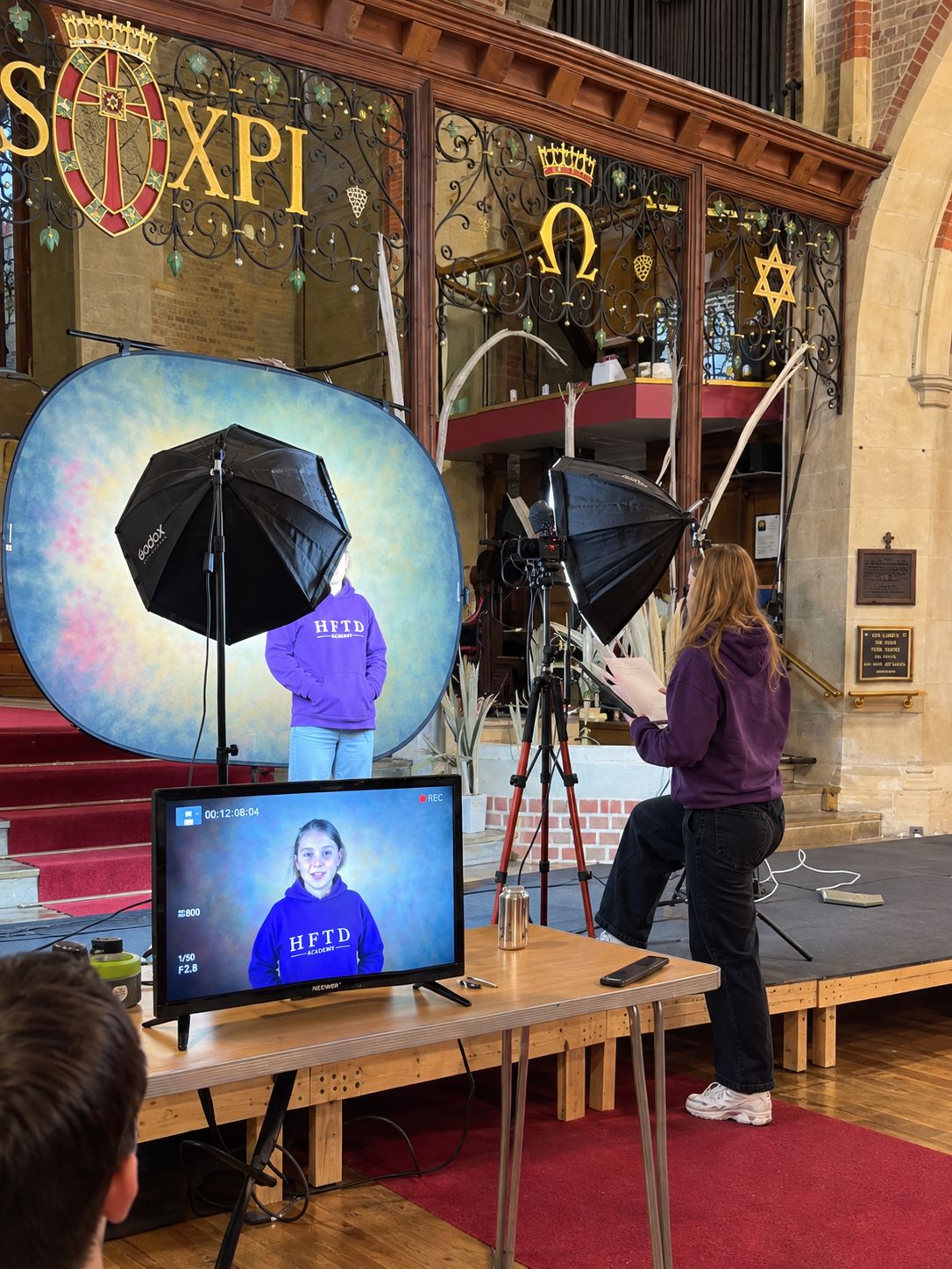 HFTD Junior filming a self-tape in front of the camera, with the take showing on the monitor
