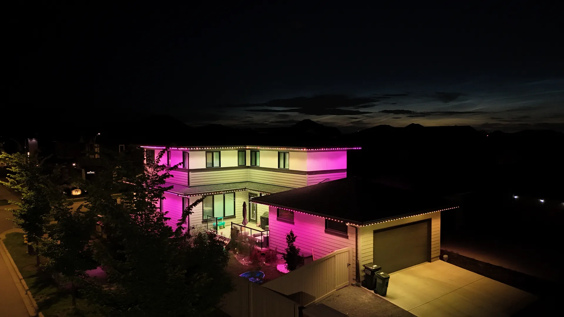 Home lit in pink and purple permanent LED lighting