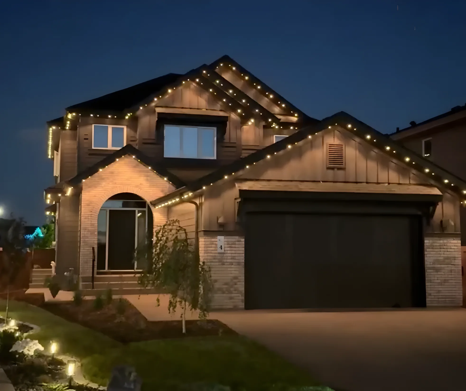 House with Horizon permanent roofline lights on