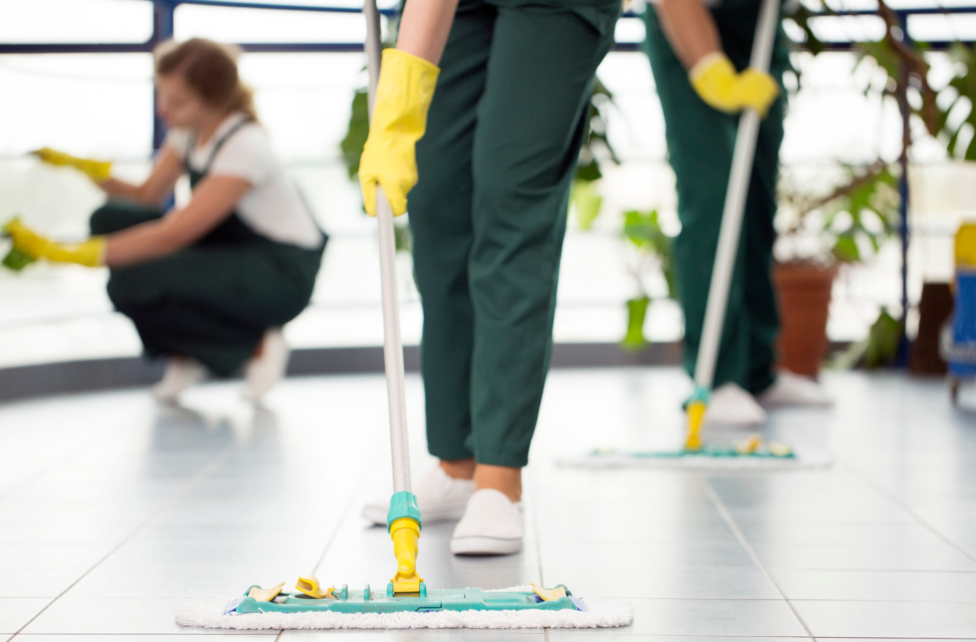 CleanCo cleaning team mopping a medical centre floor