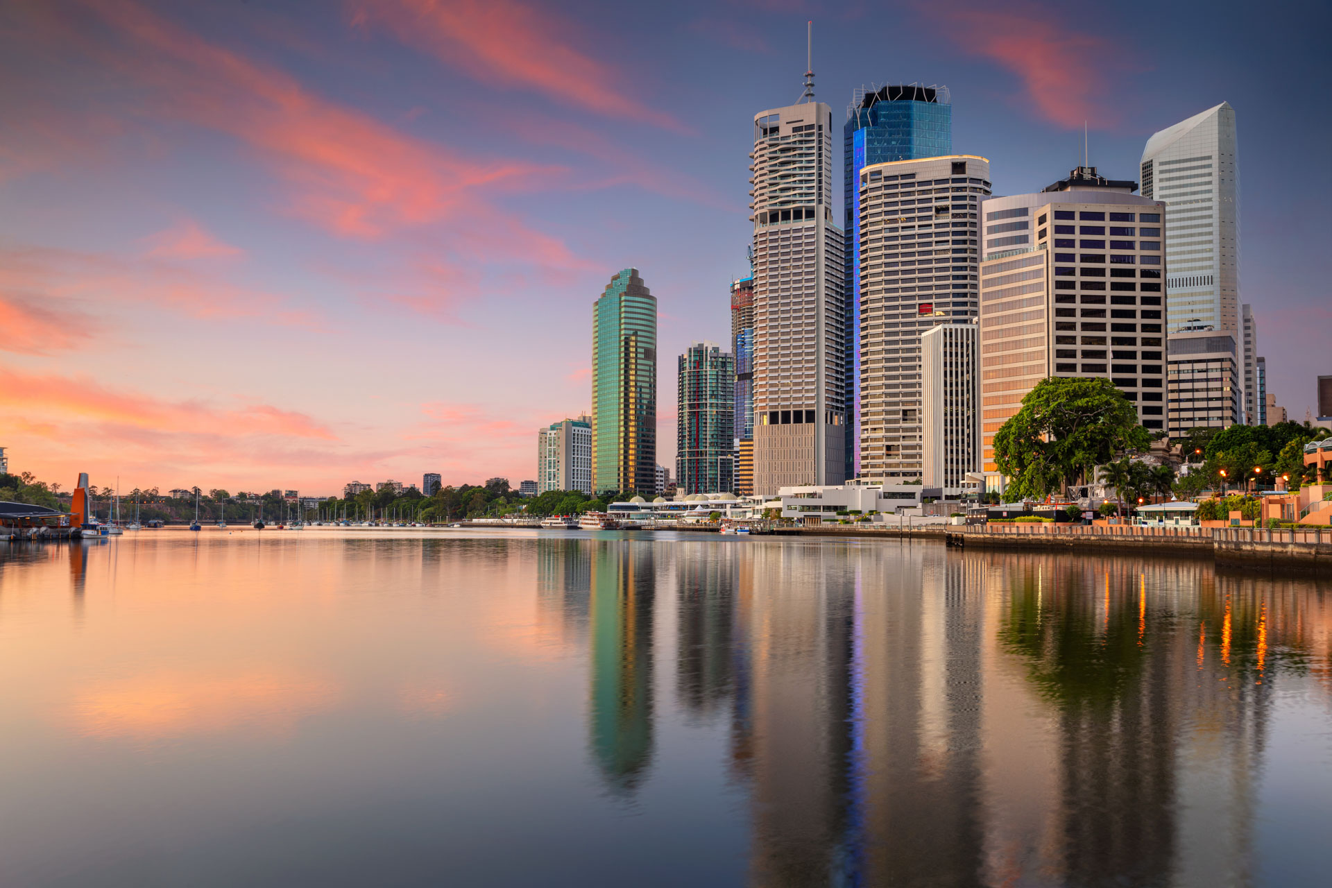 Brisbane city skyline reflected in the Brisbane River at sunset