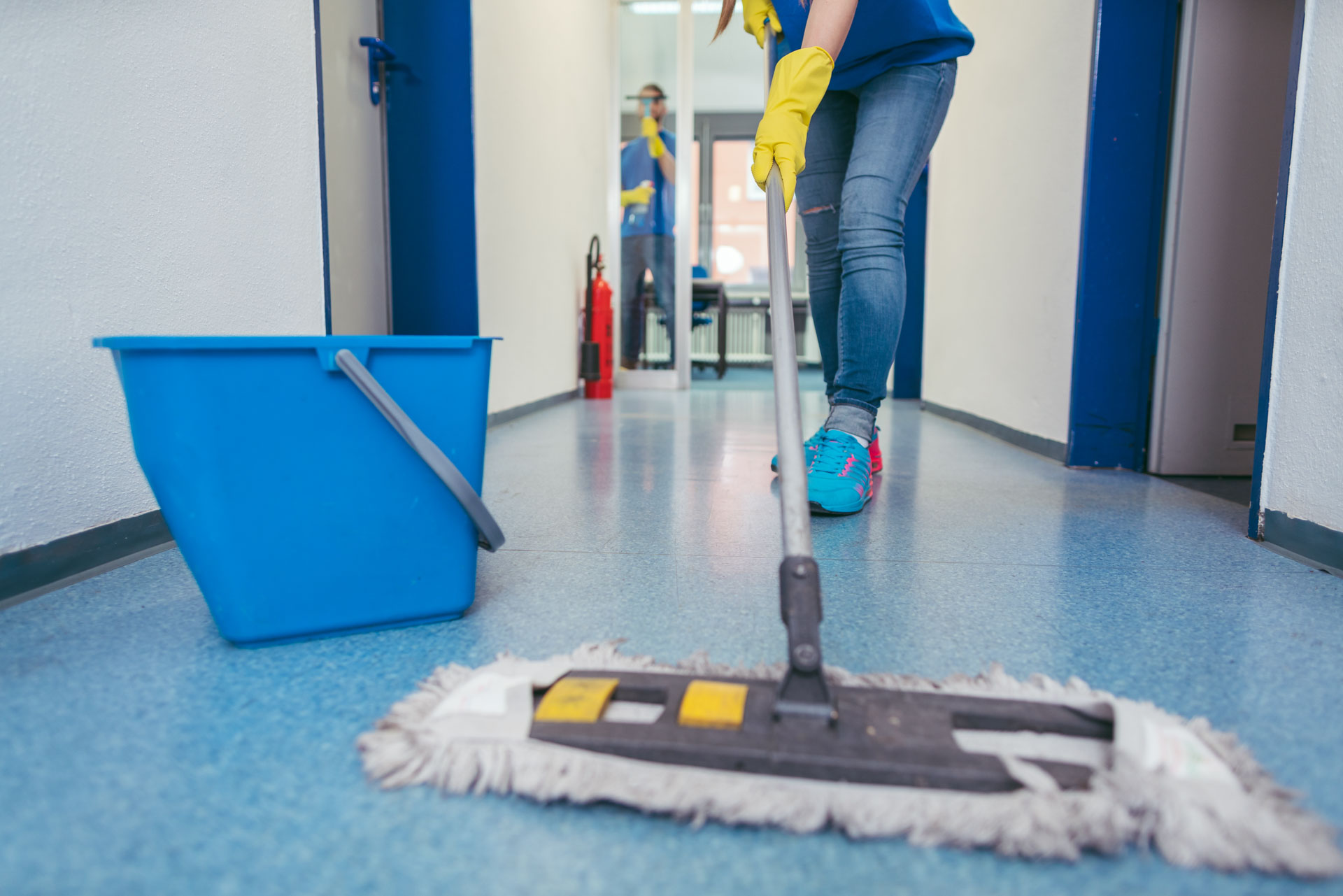 CleanCo cleaner servicing a commercial office