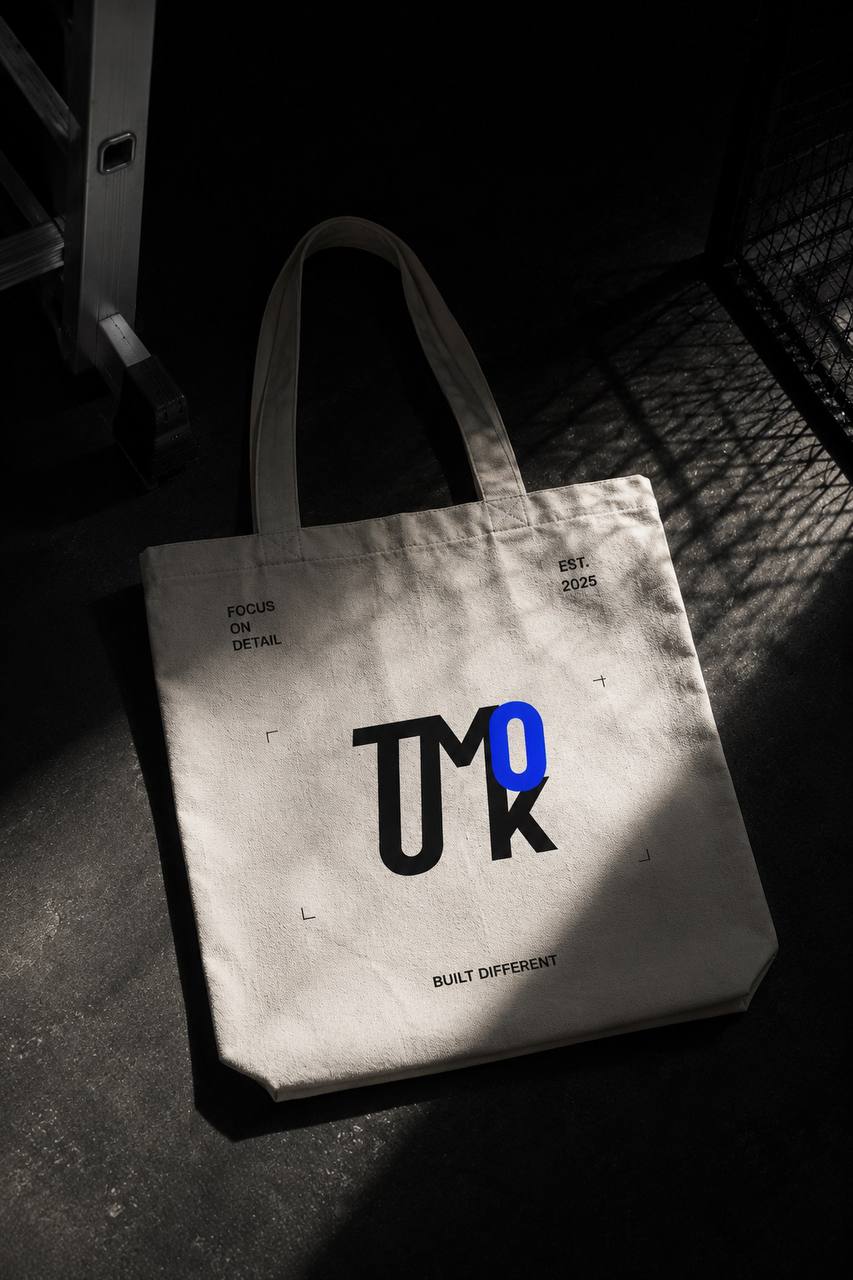 TUMKO.DESIGN tote bag — studio identity mockup