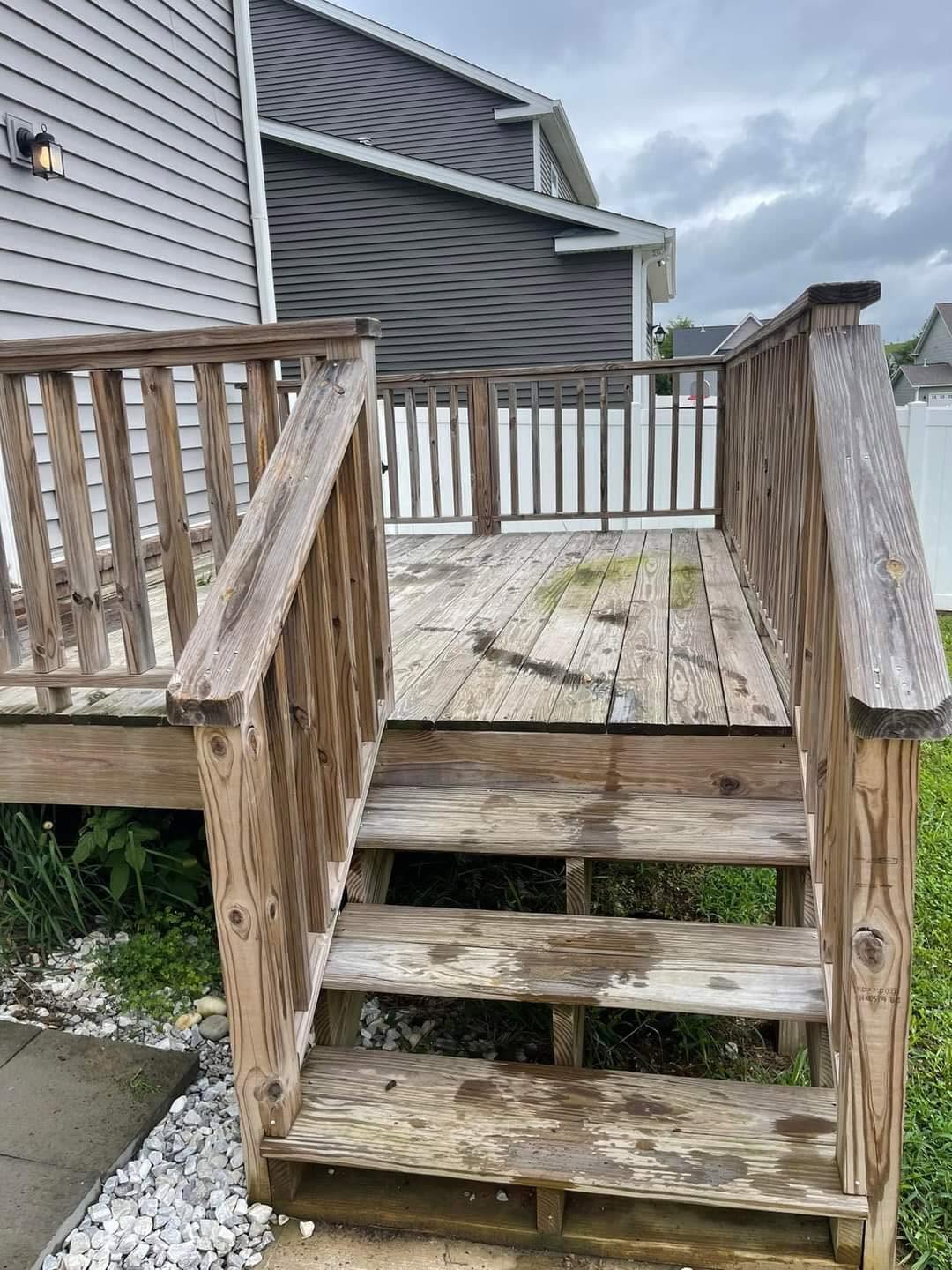Weathered deck boards before restoration by Prowash Missouri.