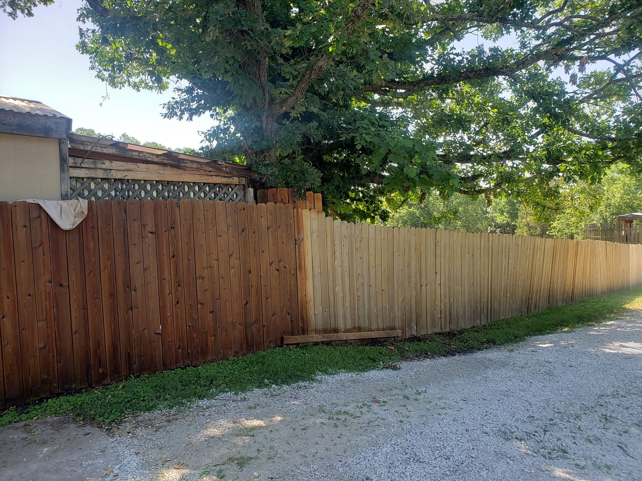 Long wood privacy fence with a clean, even finish.